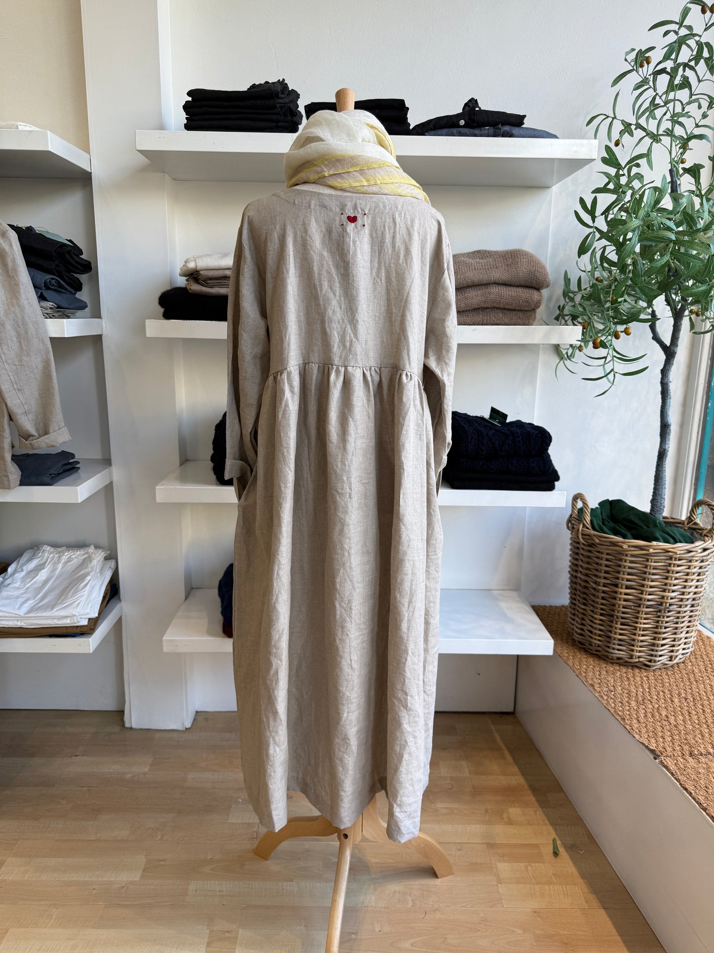 Refined and timeless, the Willow Linen Gathered Dress in navy brings effortless sophistication to everyday dressing. Made from 100% pure linen, this piece features a relaxed, free-flowing fit with a softly gathered waist that creates gentle structure and movement. The rich navy hue adds depth and versatility, making it a year-round staple that transitions seamlessly from day to evening. Designed with a round neckline and full-length sleeves, it layers beautifully with scarves, cardigans, or jackets. Comfort
