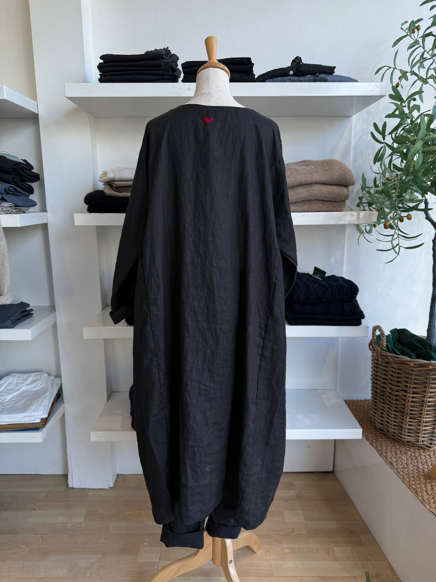 The Marin Linen Midi Dress blends relaxed elegance with everyday ease. Crafted from 100% breathable linen, this dress features a gently gathered waistline that offers a soft, flattering drape and fluid movement. The deep navy tone adds a classic, understated charm—perfect for both casual days and more polished occasions. With its midi length, round neckline, and long sleeves, it’s designed for effortless layering and seasonless wear. Whether styled with sandals or boots, the Marin is your go-to for timeless
