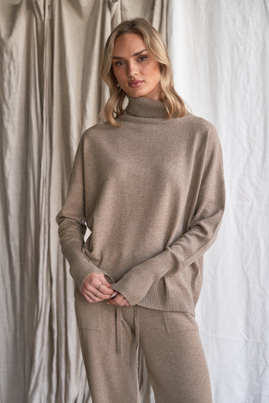 Elevate your winter wardrobe with our oversized mushroom cashmere sweater, crafted from 100% ethically sourced pure cashmere. Featuring a relaxed, slouchy silhouette, a cozy high neckline, and a soft neutral mushroom tone, this luxurious women’s knit is ideal for effortless layering.

Designed with dropped shoulders and ribbed detailing, this high neck oversized sweater delivers breathable warmth and all-day comfort — a timeless essential for cooler months.

