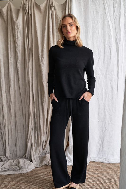 Elevate your everyday wardrobe with our black straight-leg cashmere pants, featuring visible front patch pockets and a tailored yet relaxed silhouette. Made from 100% ethically sourced pure cashmere, these women’s knit trousers offer lightweight structure, softness, and timeless appeal.

The clean, straight-leg shape and minimal detailing make these pants ideal for work, travel, or casual layering — a modern wardrobe staple in a classic black tone.