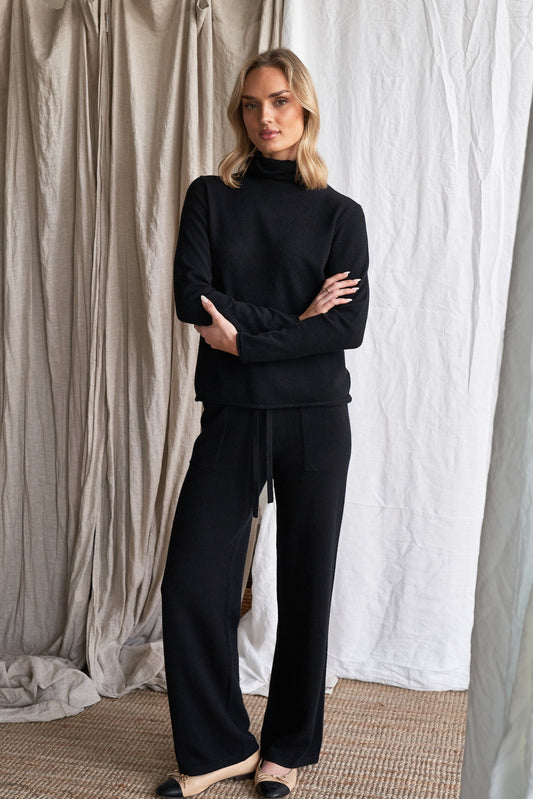 Elevate your everyday wardrobe with our black straight-leg cashmere pants, featuring visible front patch pockets and a tailored yet relaxed silhouette. Made from 100% ethically sourced pure cashmere, these women’s knit trousers offer lightweight structure, softness, and timeless appeal.

The clean, straight-leg shape and minimal detailing make these pants ideal for work, travel, or casual layering — a modern wardrobe staple in a classic black tone.