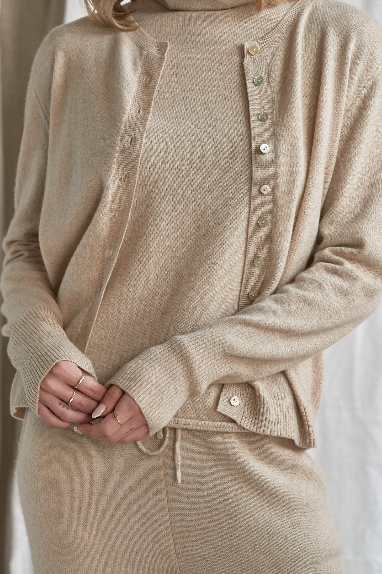 Oatmeal Cashmere Cardigan – Women’s Pure Cashmere Knit with Mother-of-Pearl Buttons

Wrap yourself in understated luxury with our women’s oatmeal cashmere cardigan, crafted from 100% premium-grade cashmere. Designed with a flattering relaxed fit and finished with mother-of-pearl buttons, this soft neutral knit is the perfect balance of comfort and elegance.

Ideal for layering through every season, this beige cashmere cardigan is lightweight yet warm, offering breathability, softness, and timeless style. 