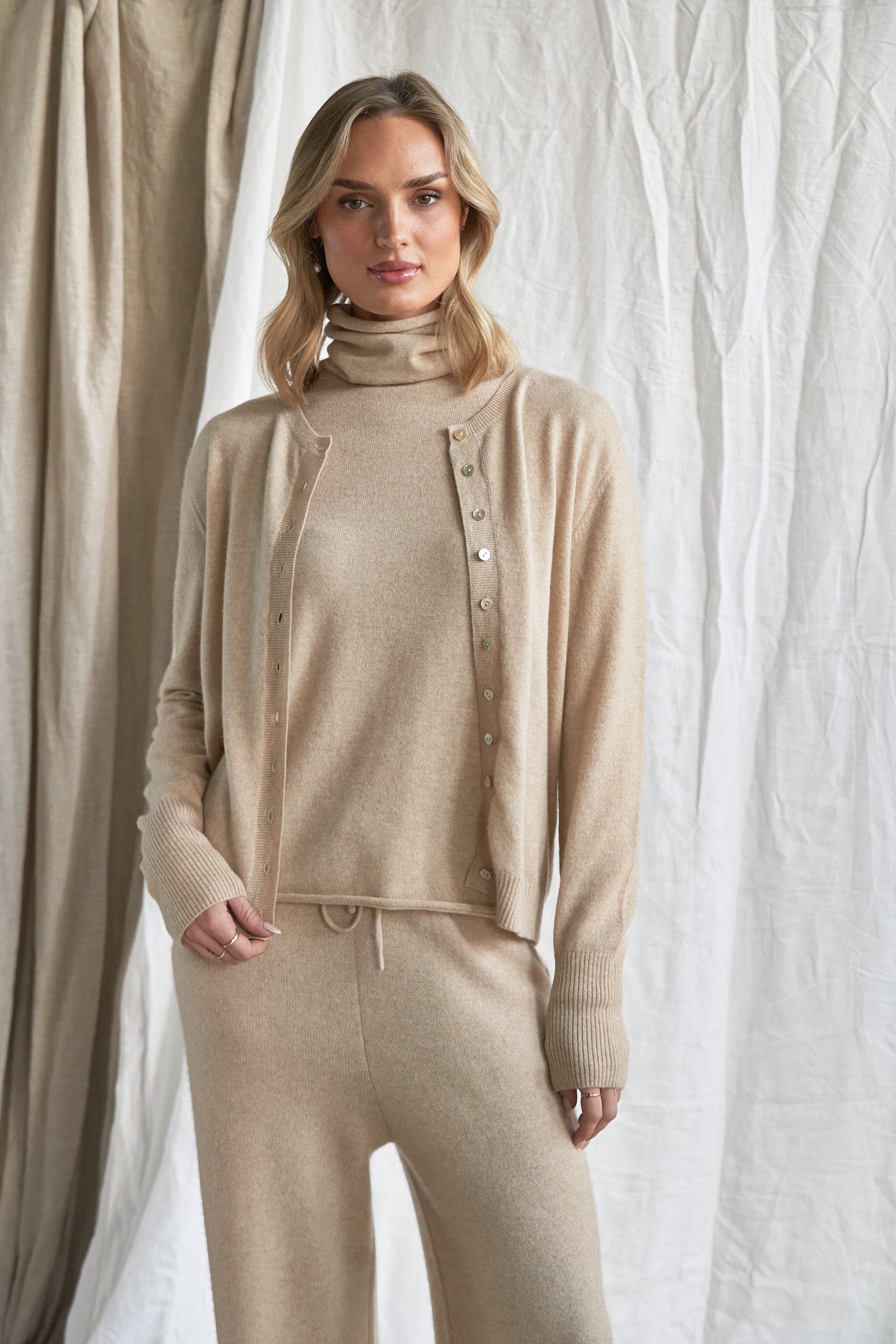 Oatmeal Cashmere Cardigan – Women’s Pure Cashmere Knit with Mother-of-Pearl Buttons

Wrap yourself in understated luxury with our women’s oatmeal cashmere cardigan, crafted from 100% premium-grade cashmere. Designed with a flattering relaxed fit and finished with mother-of-pearl buttons, this soft neutral knit is the perfect balance of comfort and elegance.

Ideal for layering through every season, this beige cashmere cardigan is lightweight yet warm, offering breathability, softness, and timeless style. 