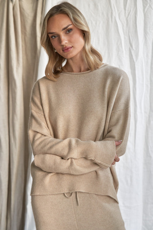 Oatmeal Cashmere Sweater with Rolled Edges – Women’s Relaxed Fit | 100% Pure Cashmere

Add quiet elegance to your wardrobe with our oatmeal cashmere sweater, crafted from 100% pure, ethically sourced cashmere and finished with soft rolled edges for a naturally relaxed look. This women’s cashmere knit features a slightly boxy silhouette, a cozy feel, and a versatile neutral tone that styles effortlessly from season to season.

Lightweight yet insulating, this timeless sweater is perfect for layering or weari